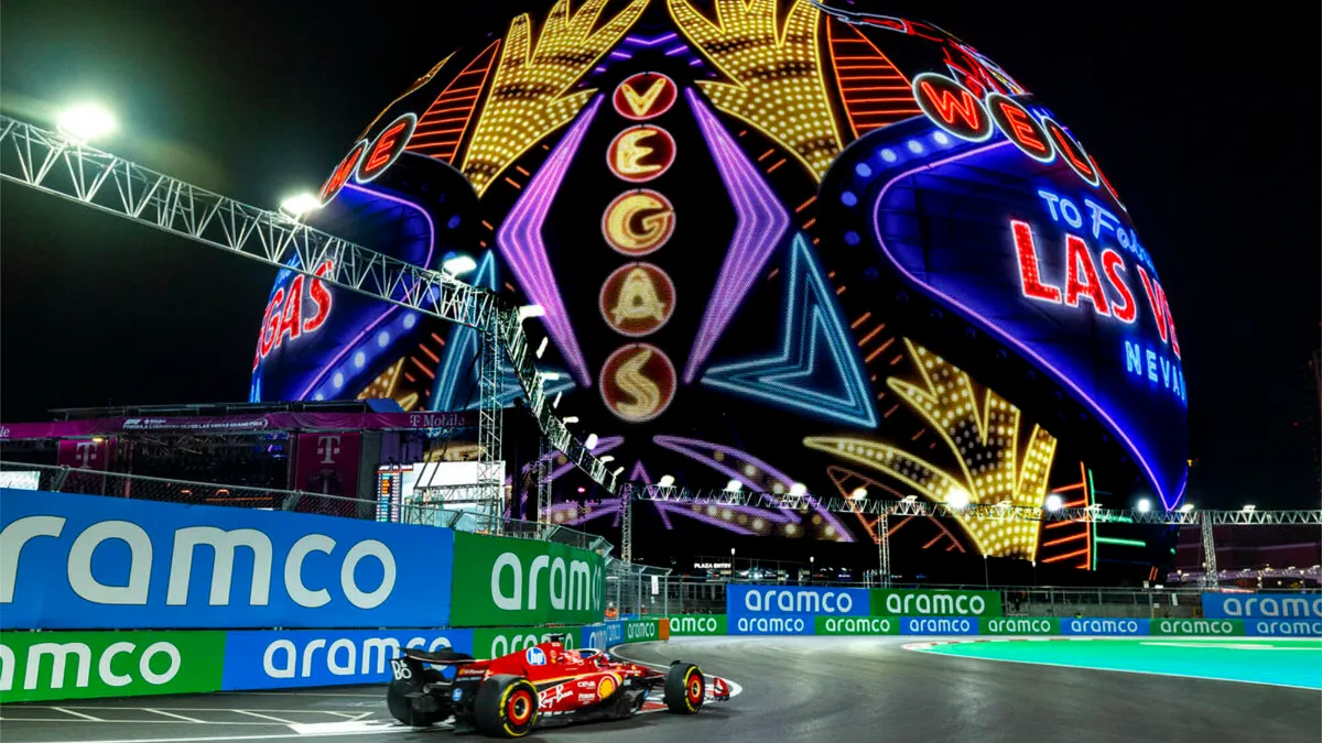 Formula 1 car on track under lights